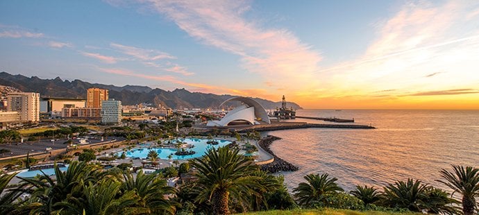 Santa Cruz de Tenerife waterfront with lush gardens, the Auditorio de Tenerife, and ocean views at sunset | MSC Cruises Santa Cruz de Tenerife waterfront with lush gardens, the Auditorio de Tenerife, and ocean views at sunset | MSC Cruises
