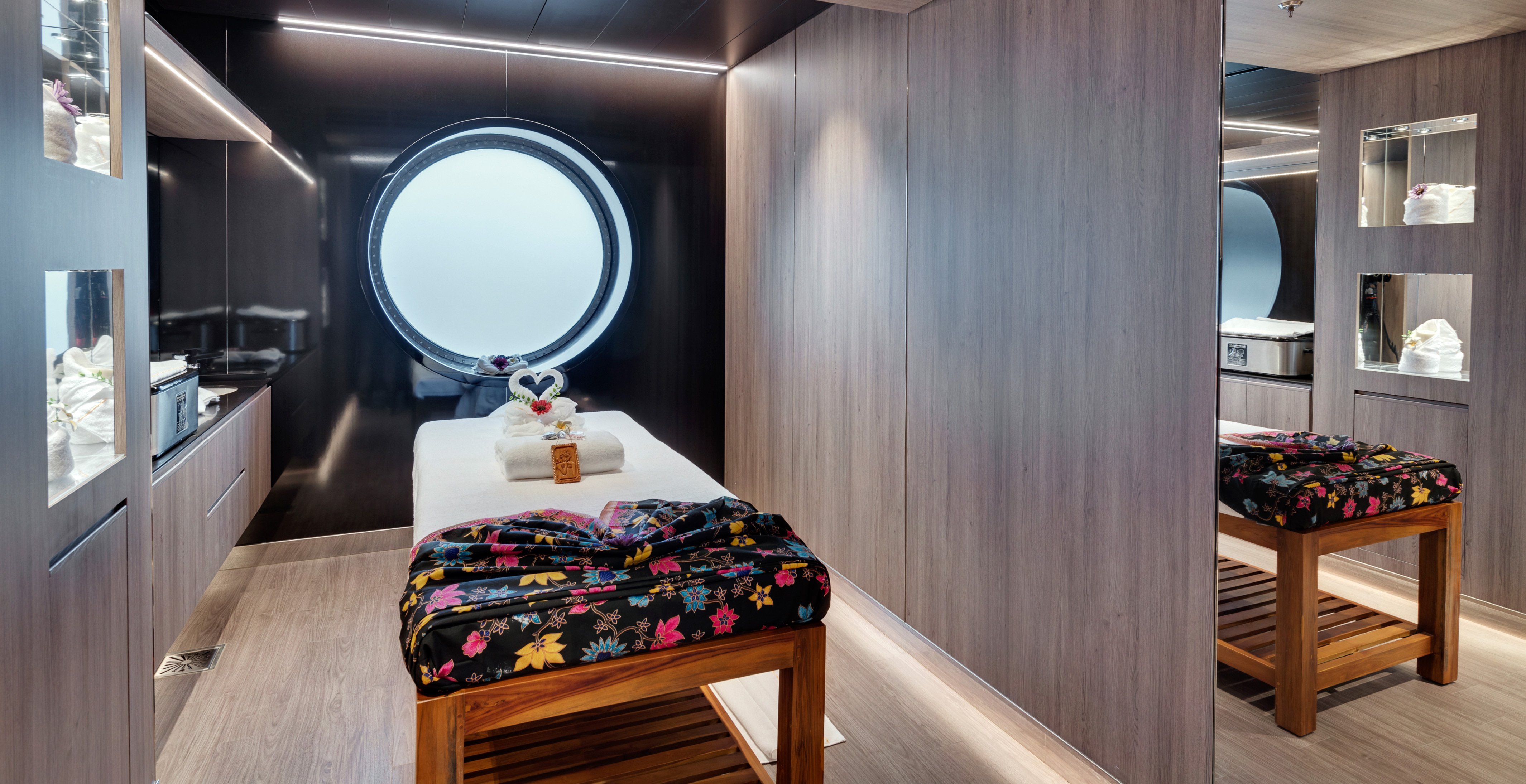 Luxurious spa treatment room with ocean-view porthole onboard | MSC Cruises