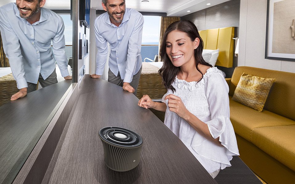 Modern cruise cabin with ocean view, featuring a stylish speaker on the desk | MSC Cruises Modern cruise cabin with ocean view, featuring a stylish speaker on the desk | MSC Cruises