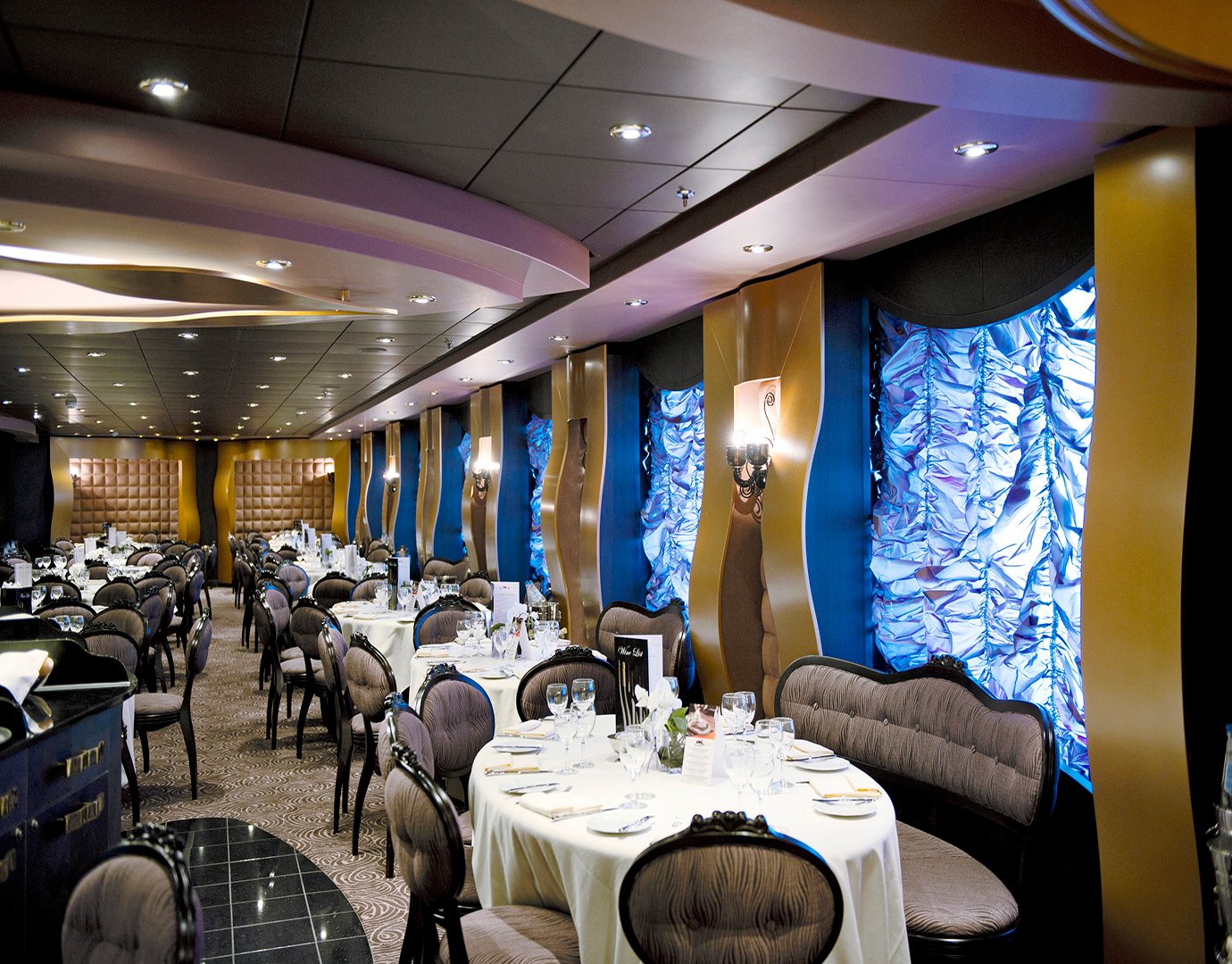 Elegant onboard dining area with luxurious decor and table settings | MSC Cruises Elegant onboard dining area with luxurious decor and table settings | MSC Cruises
